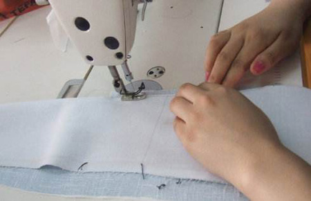 定做工作服生產中的倒回針